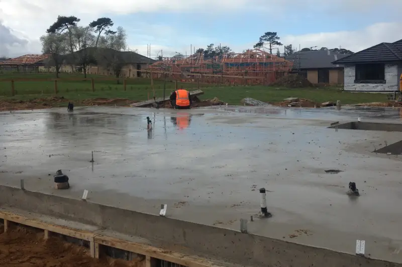 Freshly finished concrete floor slab with the boxing still in place