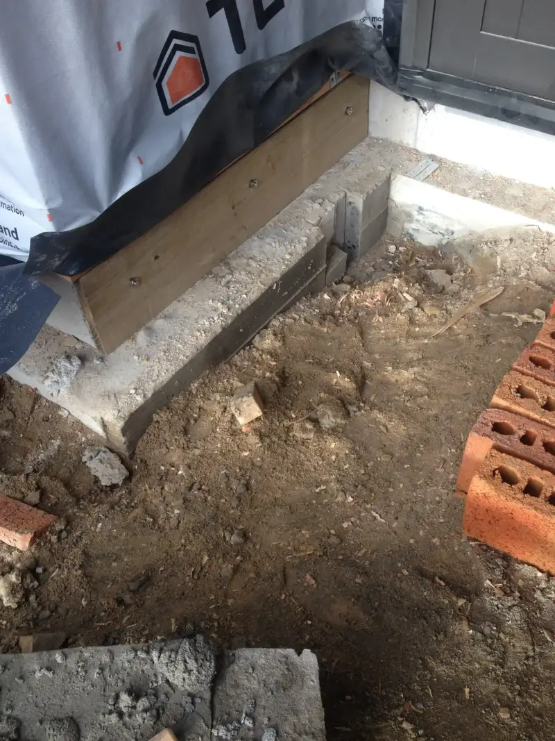 Concrete foundation repair work in progress